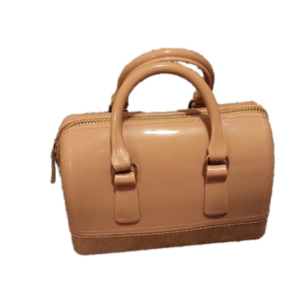 A small purse made of PVC material with gold accents and a detachable chain.